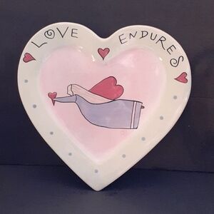 Love Endures ceramic wall hanging